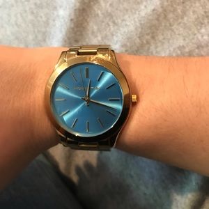 Michaels Kors watch. Gold with blue face